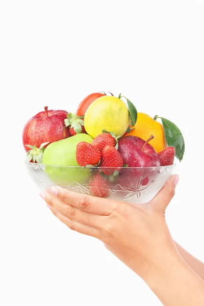 Hand holding bowl of fruits — Stock Photo, Image