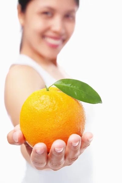 Woman holding orange — Stock Photo, Image