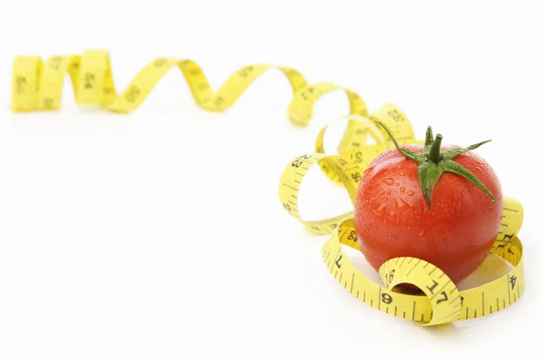 Tomato with measuring tape — Stock Photo, Image