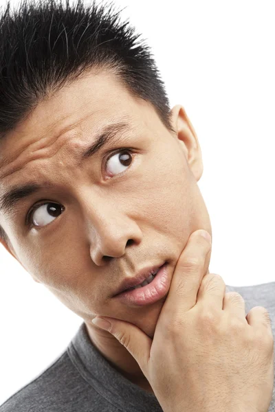 Thoughful Asian young man — Stock Photo, Image