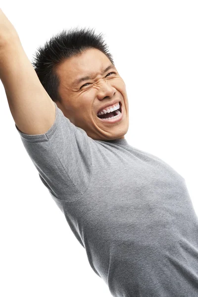 Азиатский мужчина кричит, чтобы выразить свое волнение — стоковое фото