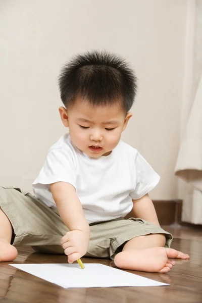 Asian toddler busy drawing — Stock Photo, Image