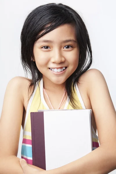 Little girl holding book — Stock Photo, Image