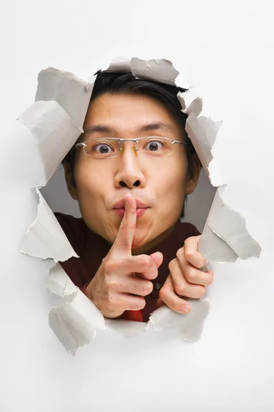 Man from cracked wall tell you to be quiet — Stock Photo, Image