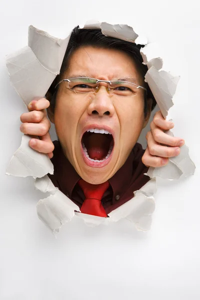 Άνθρωπος ουρλιάζοντας από την τρύπα στον τοίχο — Φωτογραφία Αρχείου