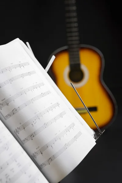 Musical chords and guitar on background — Stock Photo, Image