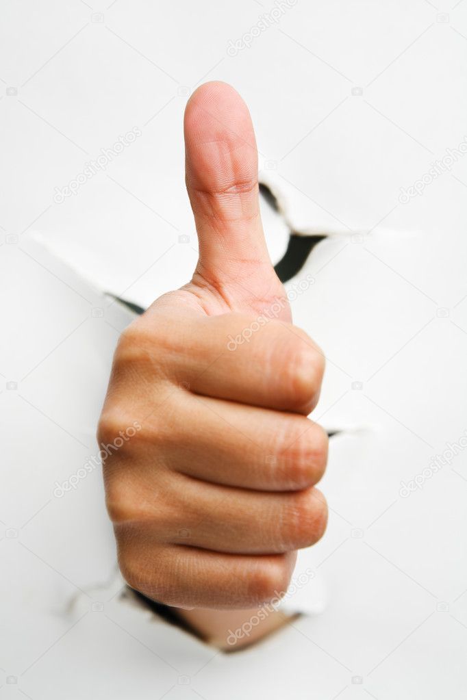 Thumb up from crack wall
