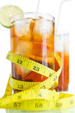 Two glass of soft drinks with tape measure clipart