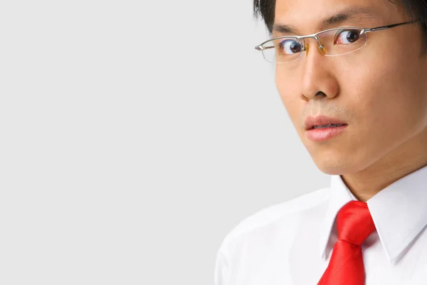 Asian businessman gazing at camera — Stock Photo, Image