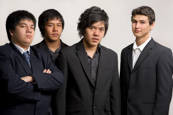 Group of young man in black suit — Stock Photo, Image