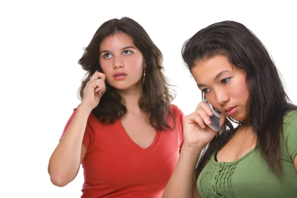 Two female teenagers on the phone — Stock Photo, Image