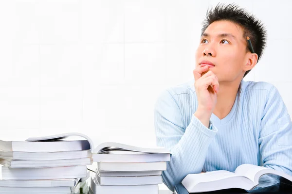 Young scholar looking for idea — Stock Photo, Image