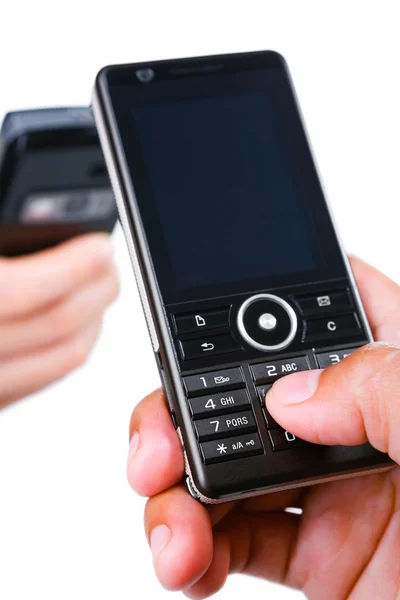 Hand using a mobile phone and the other in background — Stock Photo, Image