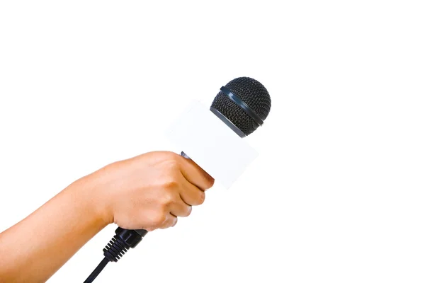Bare hand holding microphone — Stock Photo, Image