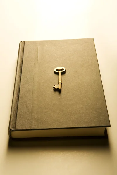 Book with golden key (warm) — Stock Photo, Image