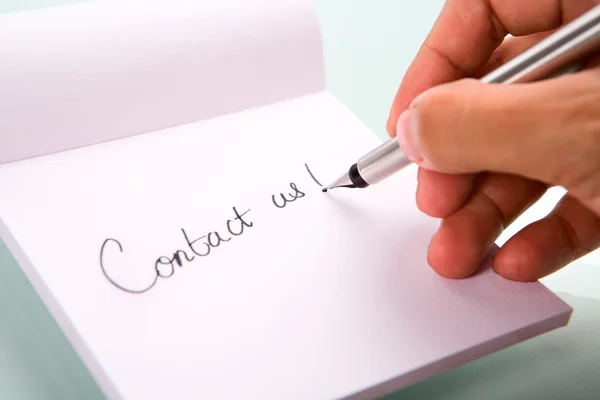 stock image Writing 'contact us'