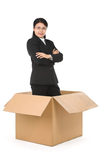 Businesswoman over box — Stock Photo, Image