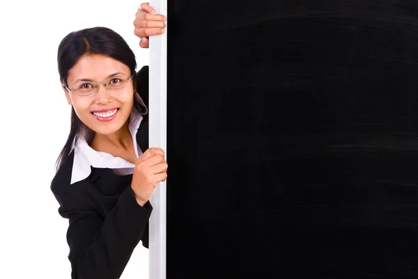 Showing up from behind blackboard — Stock Photo, Image