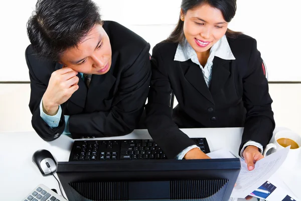 Young Asian business in office Stock Picture
