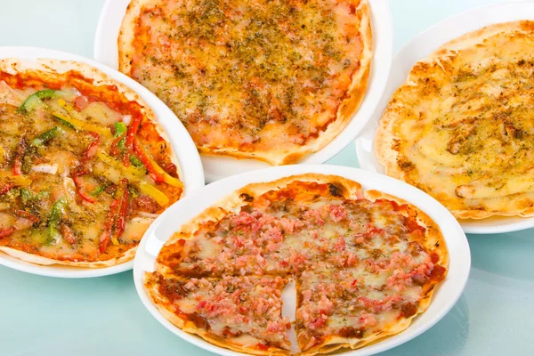 Stock image Four Pizzas