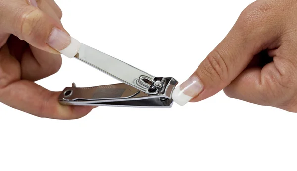 Vrouw snijden haar nagel Rechtenvrije Stockfoto's