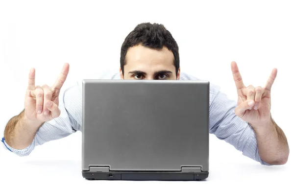 Young man behind a laptop — Stock Photo, Image