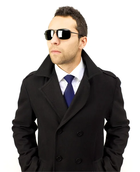 Portrait of a serious standing man with sunglasses — Stock Photo, Image