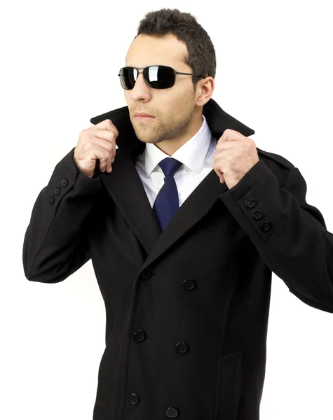 Portrait of a serious standing man with sunglasses — Stock Photo, Image