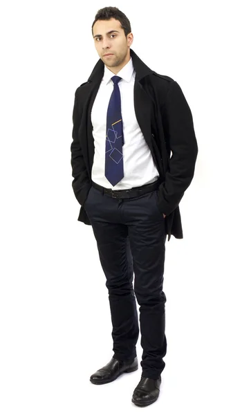 Портрет серьезного молодого бизнесмена с руками в карманах — стоковое фото