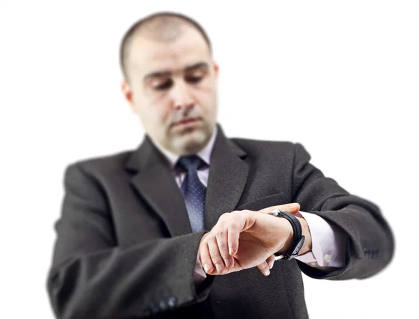 Surprised business man consulting his watch — Stock Photo, Image