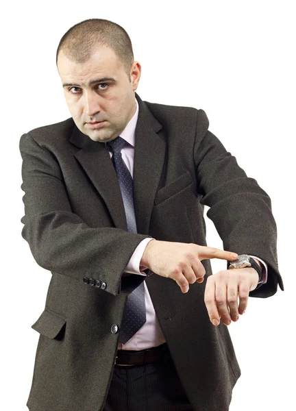 Ernsthafter erwachsener Geschäftsmann zeigt auf seine Uhr — Stockfoto