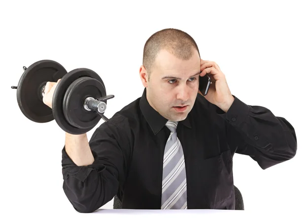 Hombre de negocios adulto en el teléfono haciendo ejercicio en el trabajo — Foto de Stock