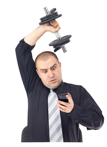 Homem de negócios adulto ao telefone fazendo fitness no trabalho — Fotografia de Stock