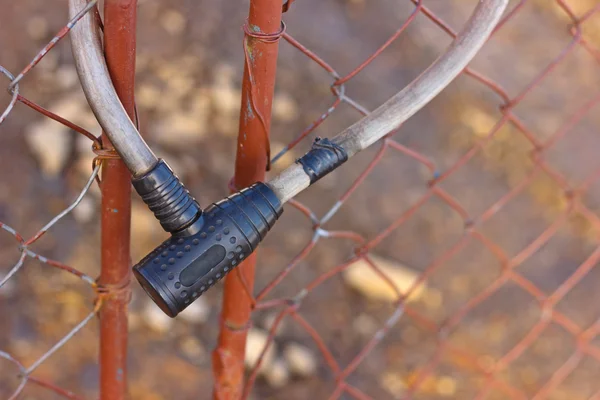 Closeup of black lock on metal fence — Stock Photo, Image