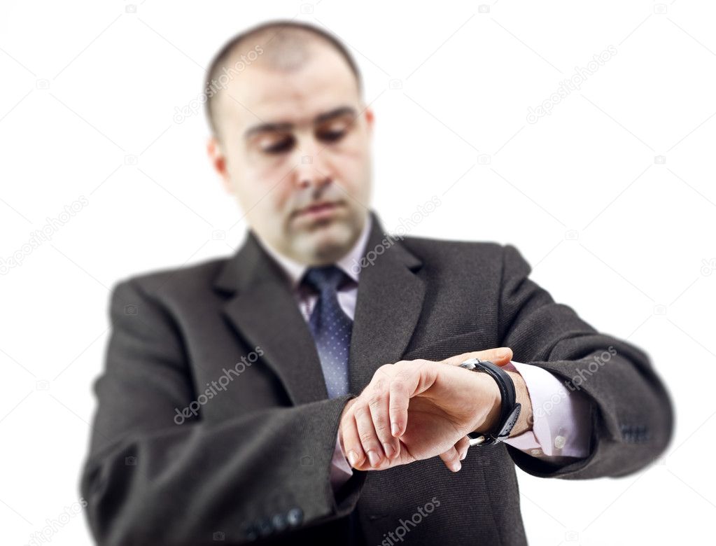 Surprised business man consulting his watch