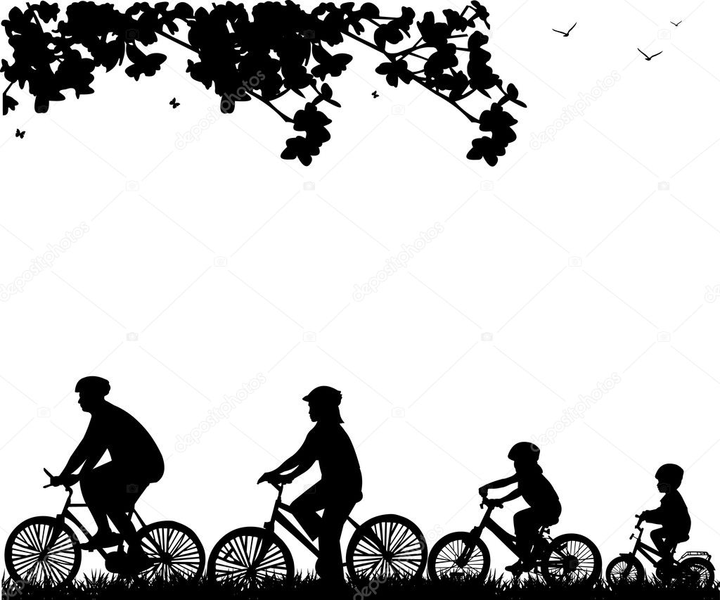 Family bike ride in park in spring silhouette