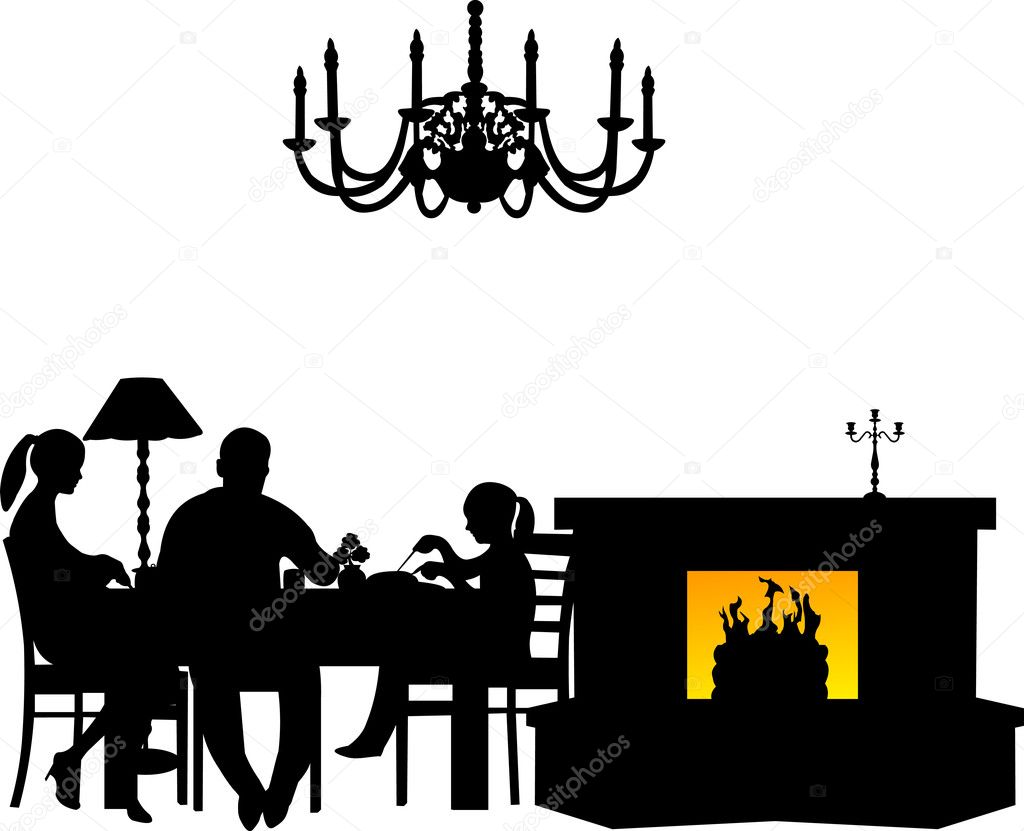 Family having their dinner at the table next to the fireplace in restaurant or dining room silhouette