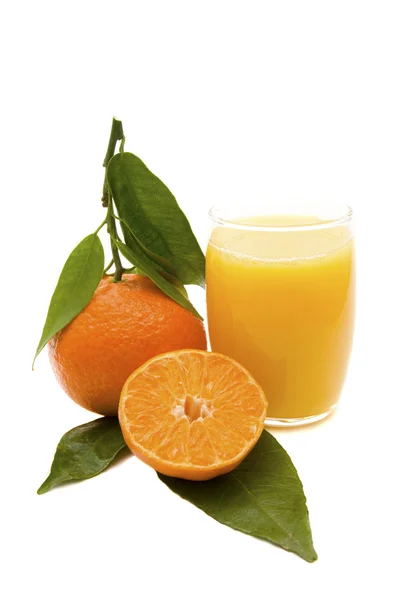 Orangenfrüchte und Saft — Stockfoto