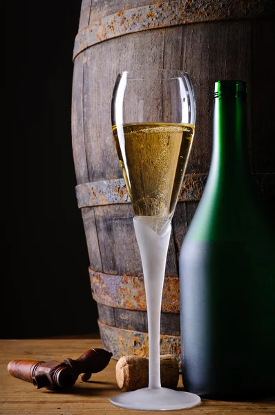 Glass and bottle of champagne — Stock Photo, Image