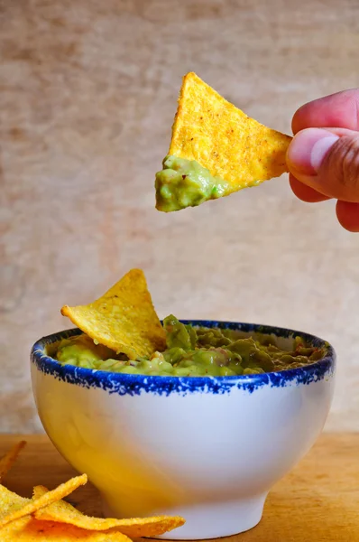 Eating nachos with dip — Stock Photo, Image
