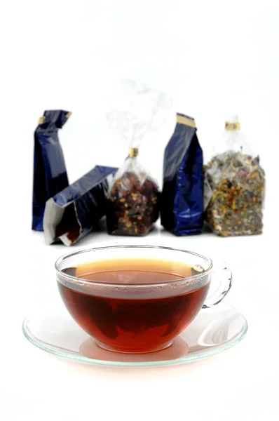 Xícara de chá e sacos — Fotografia de Stock