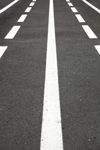 stock image Texture of asphalt and white lines