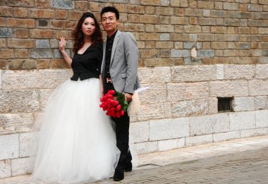 Just married chinese young couple in Kunming. clipart