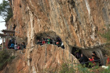 Faithfuls and tourists merge on their way up to the Longmen-Dragon Gate. clipart