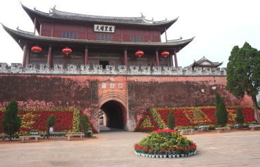 The towering Gongchen-North Gate in Weishan, Yunnan, China. clipart