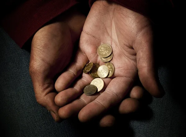 Poverty, beggar with some polish coins — Stock Photo, Image