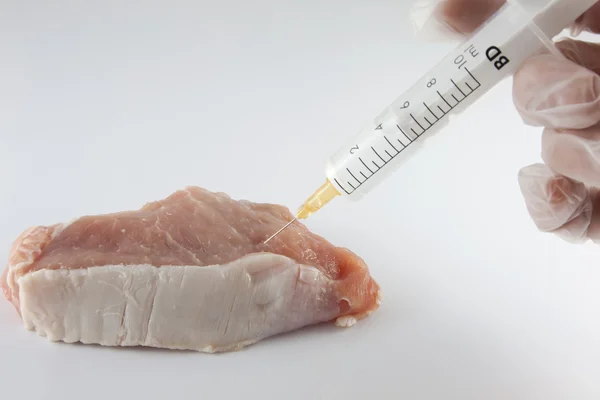 Meat and syringe researcher injecting GMO — Stock Photo, Image