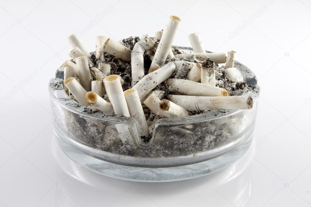 Ashtray and cigarettes on white background