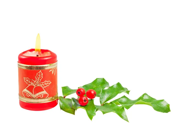 Christmas burning red candle and holly tree isolated — Stock Photo, Image