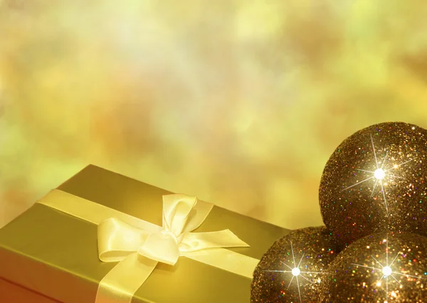 Christmas golden gift and baubles concept background — Stock Photo, Image
